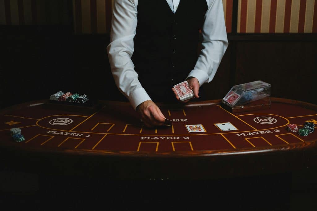 man displaying cards in casino