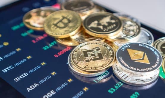 phone with crypto coins on it