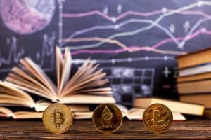 Crypto coins in front of books