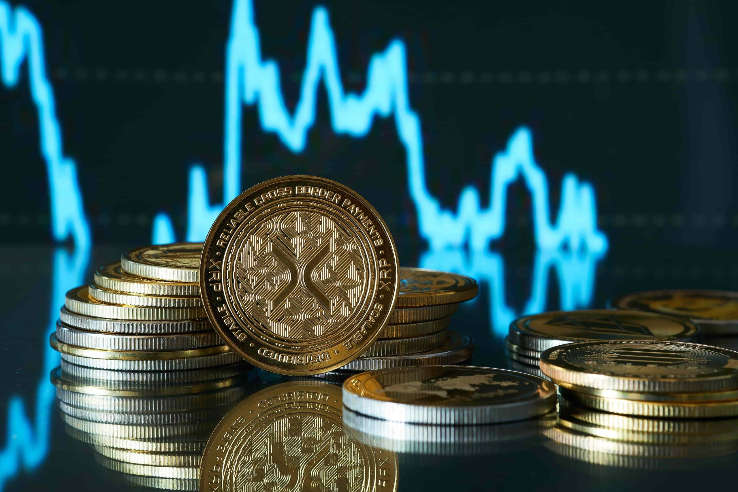 XRP tokens in front of price chart