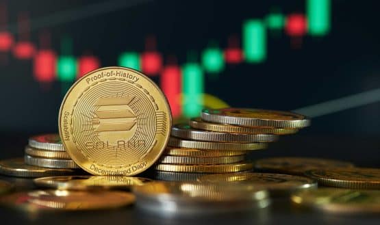 Solana coin in front of price chart