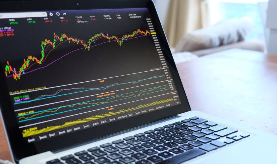 Trading charts on a laptop