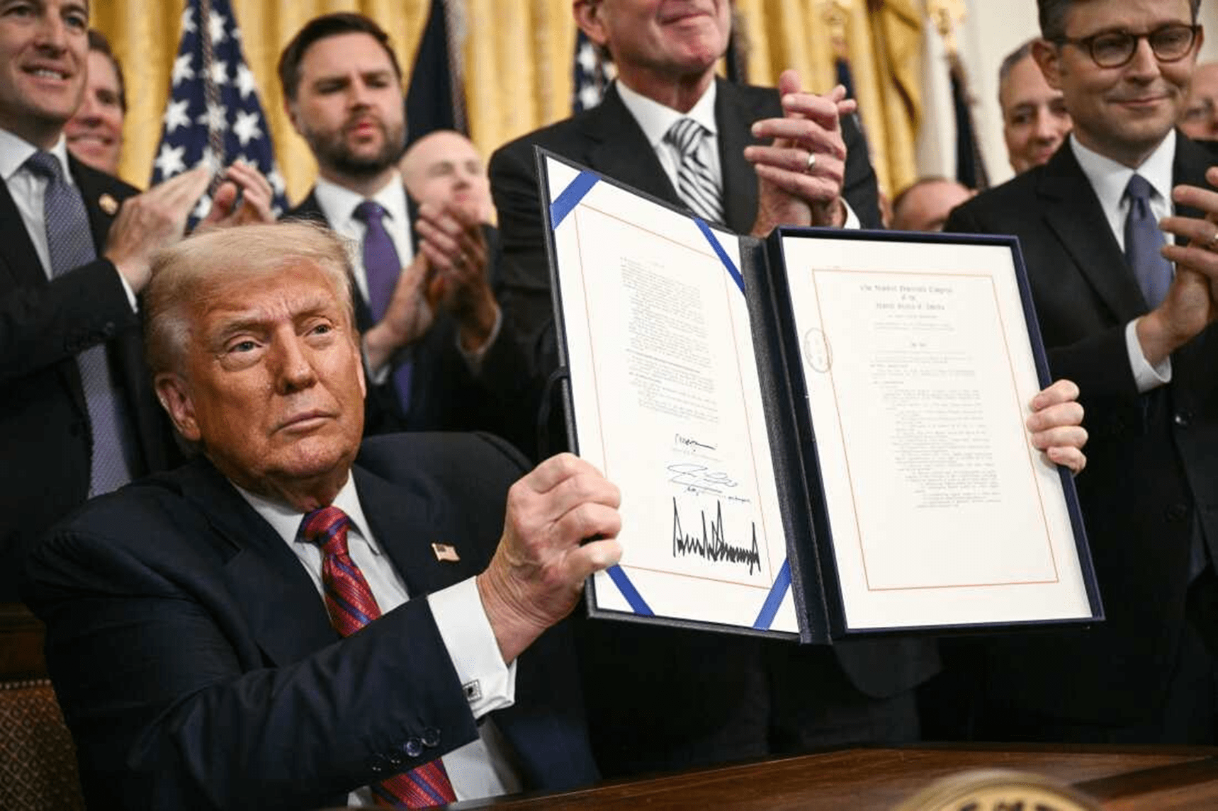 President Trump signing the GENIUS act