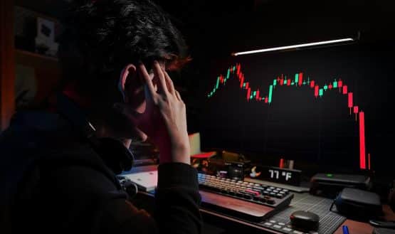 Man watching price chart fall